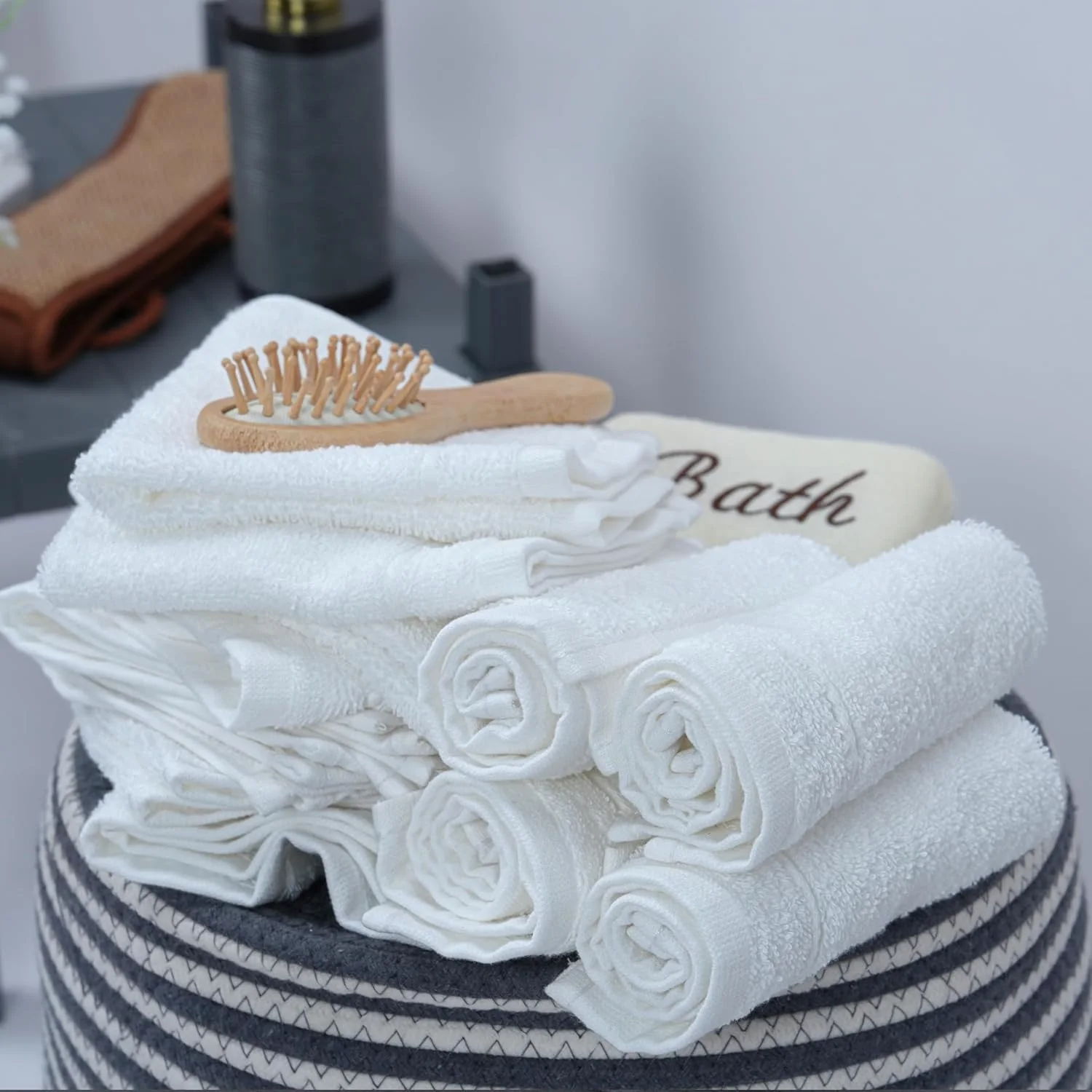 White washcloths, rolled the hotel way